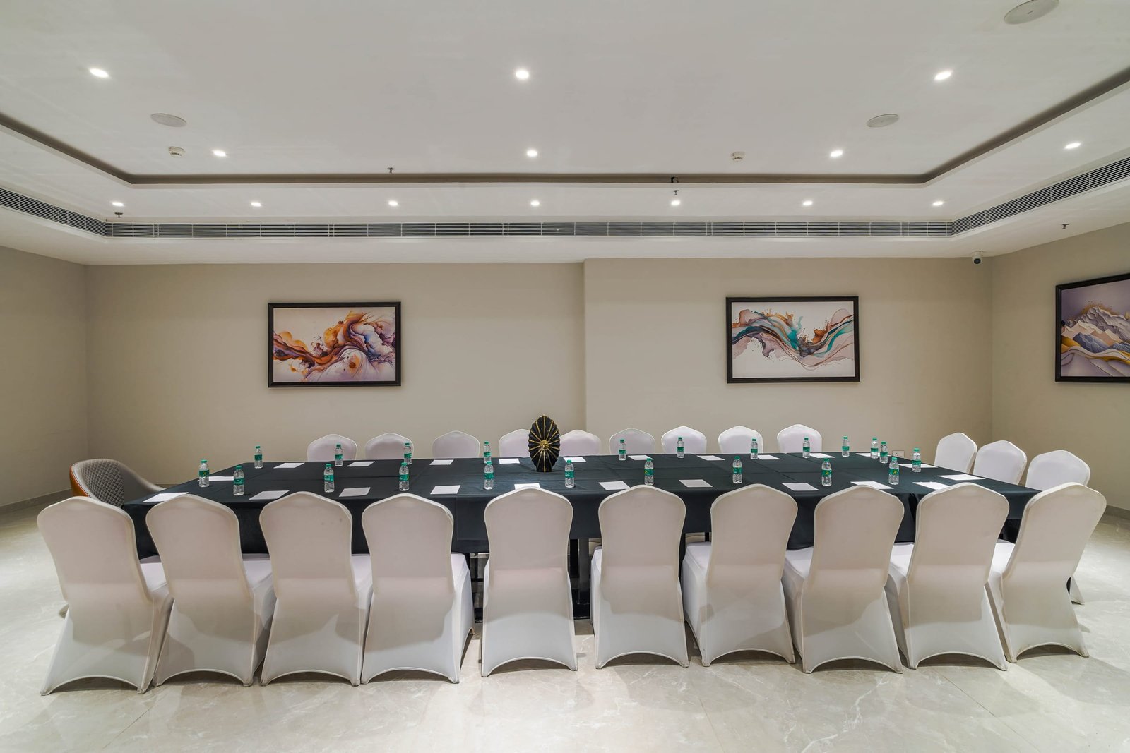 Boardroom laid out in a U-shape for a meeting
