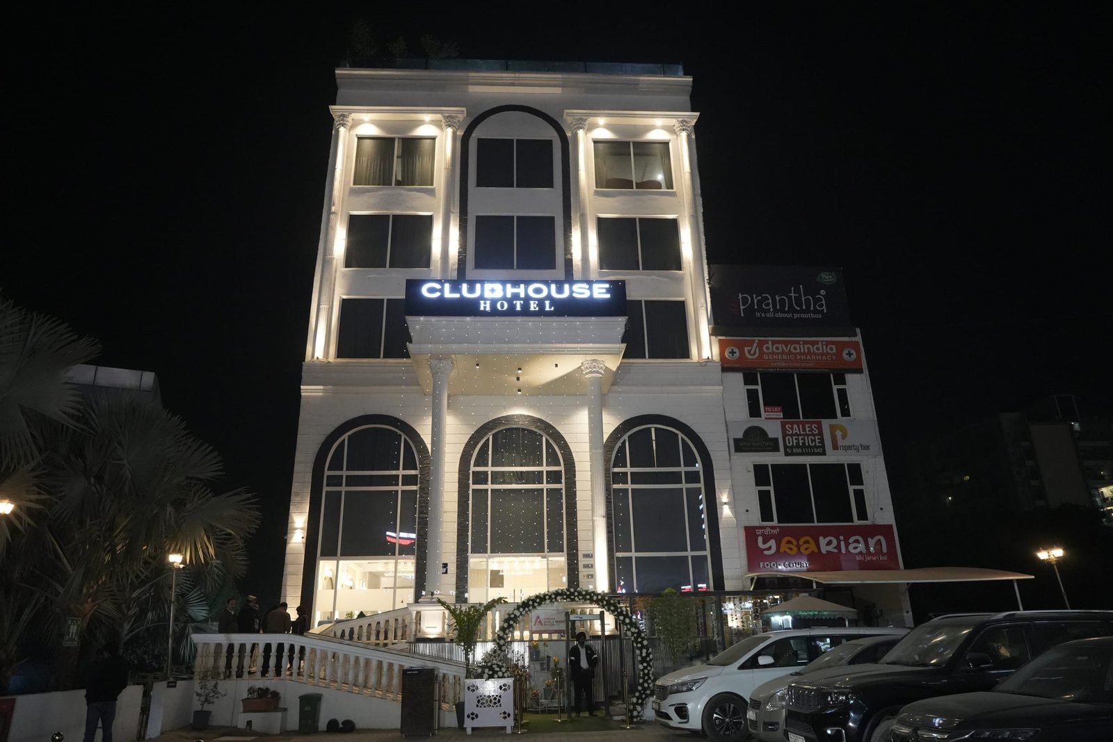 The lit frontage and portico after dark
