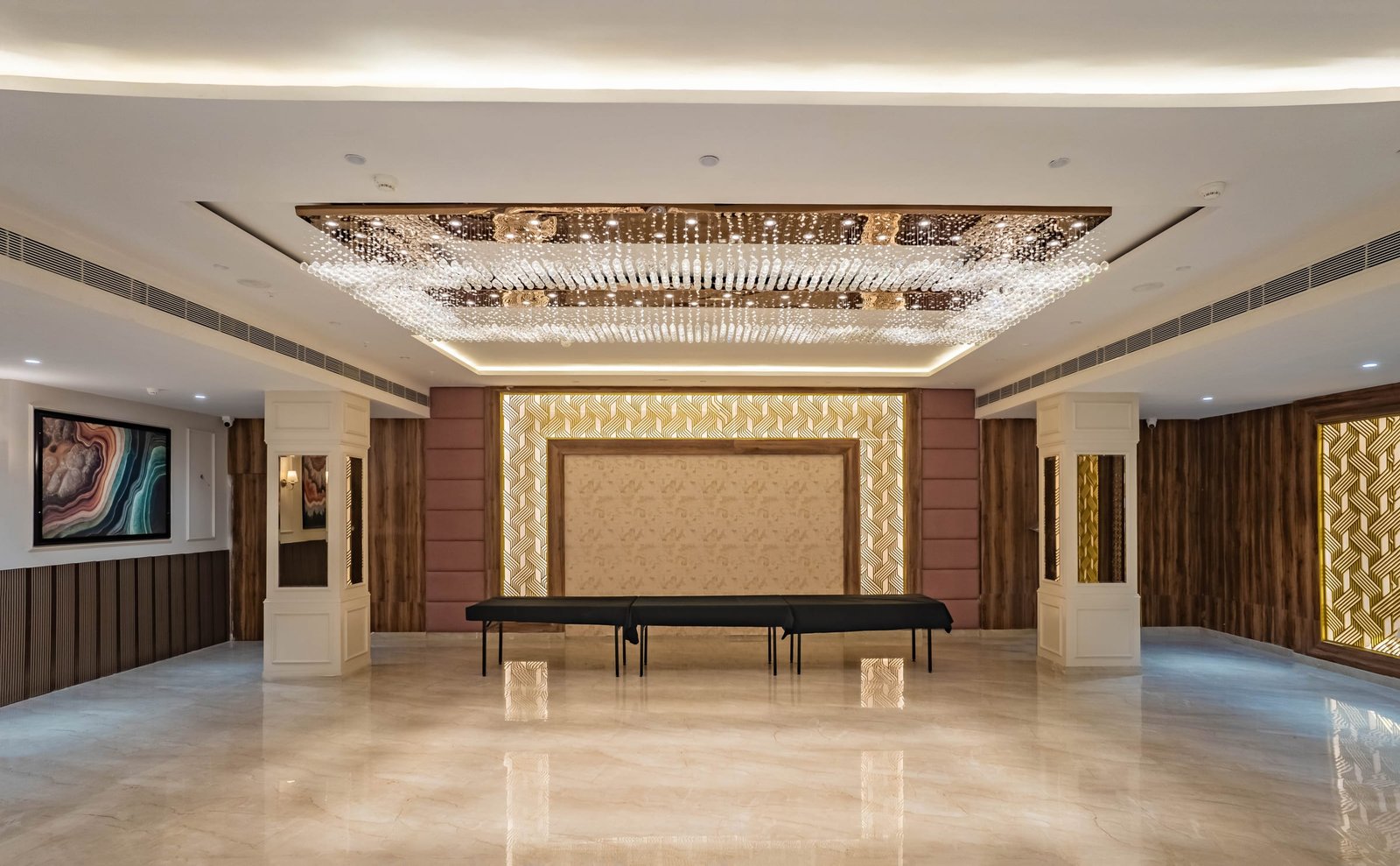 An empty function hall with the stage at the far end