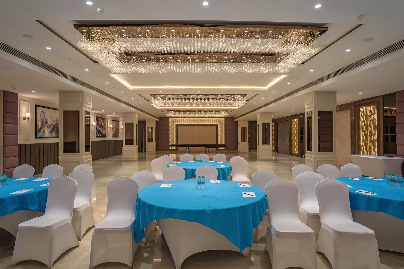 Round tables dressed for a conference lunch
