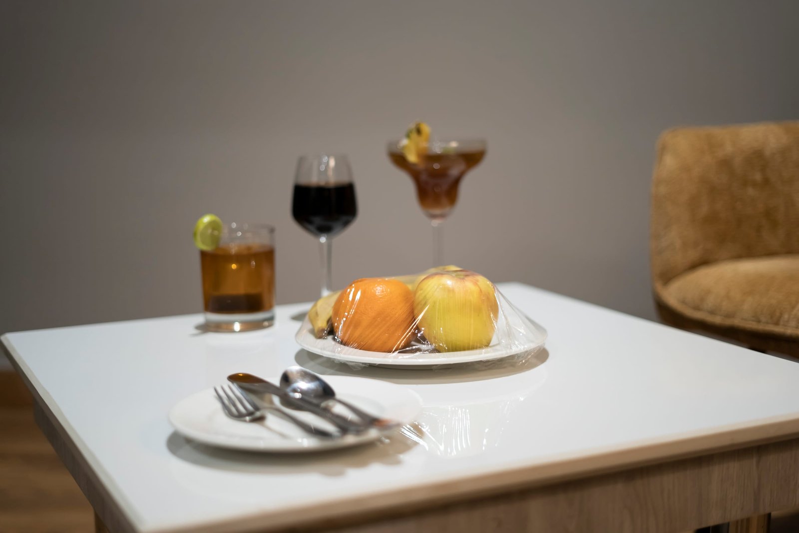 Fruit plate and a glass set out on arrival