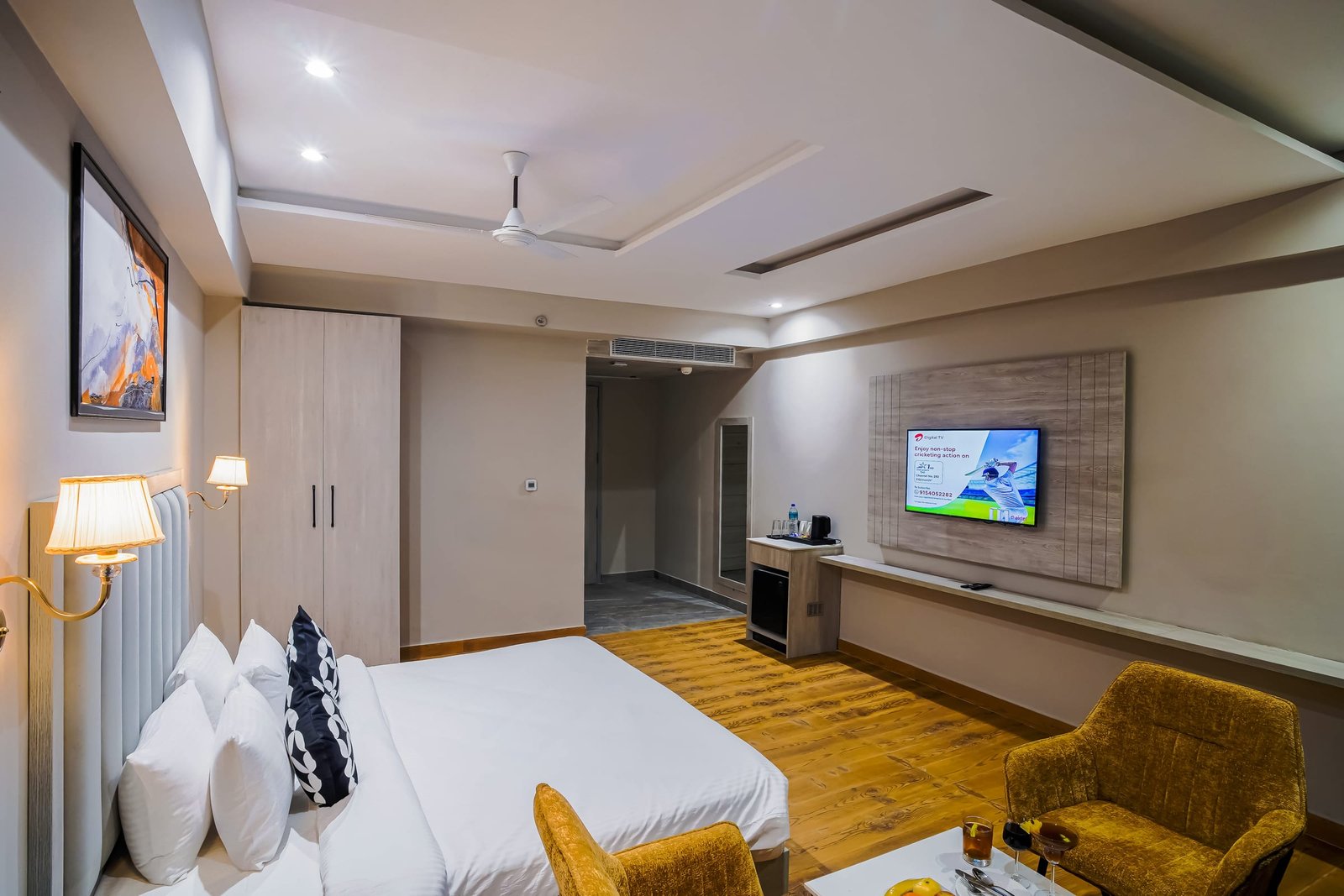 Bedroom and lounge of a suite, seen from the door