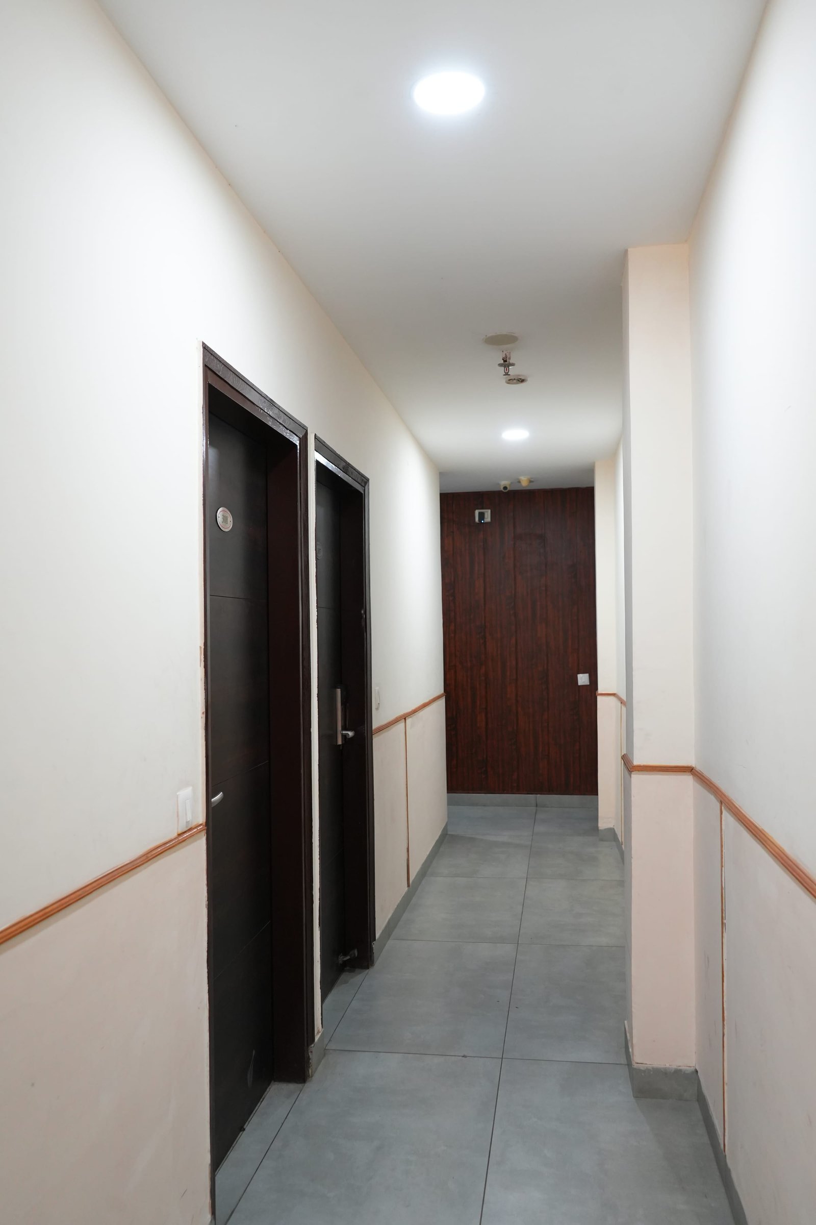 A guest-floor corridor between room doors