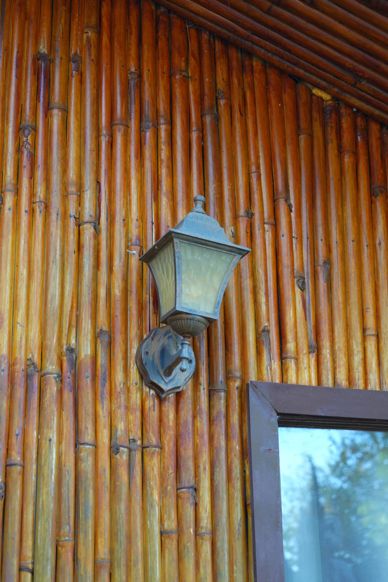 A lantern against the bamboo cladding