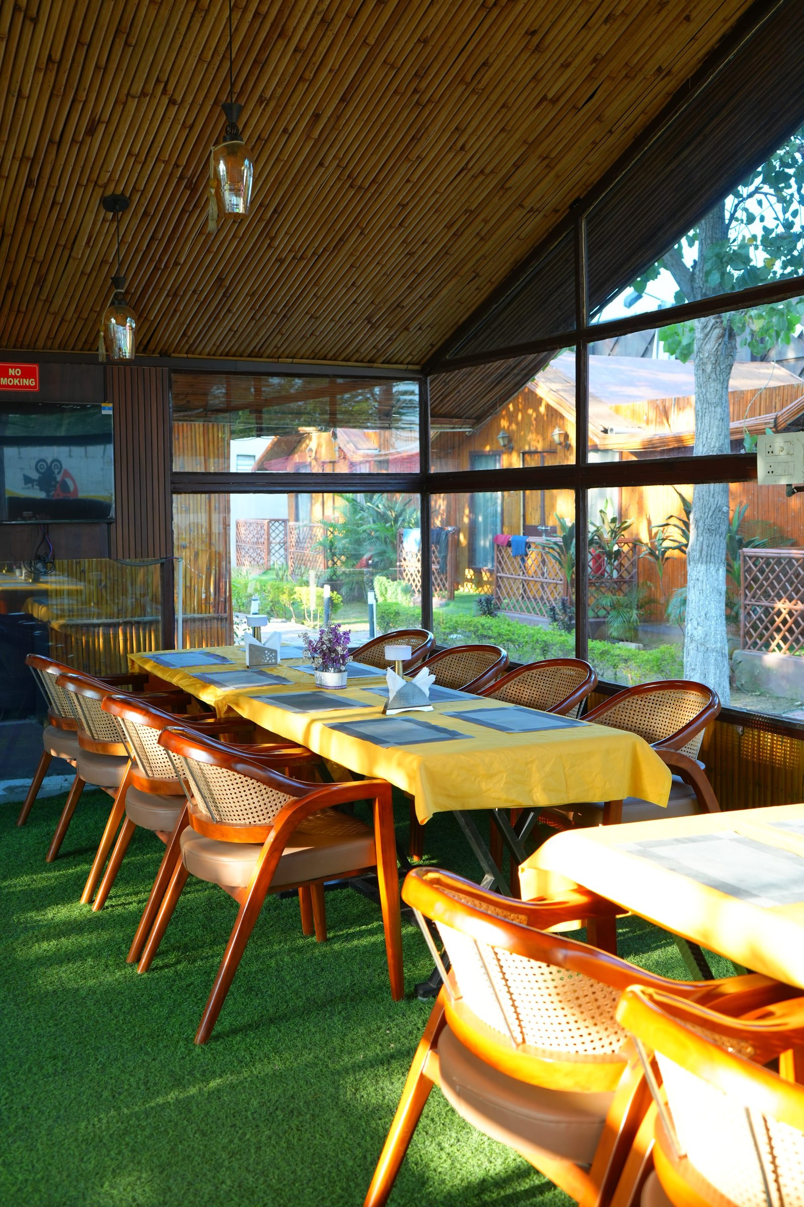 Yellow-clothed tables in the dining pavilion