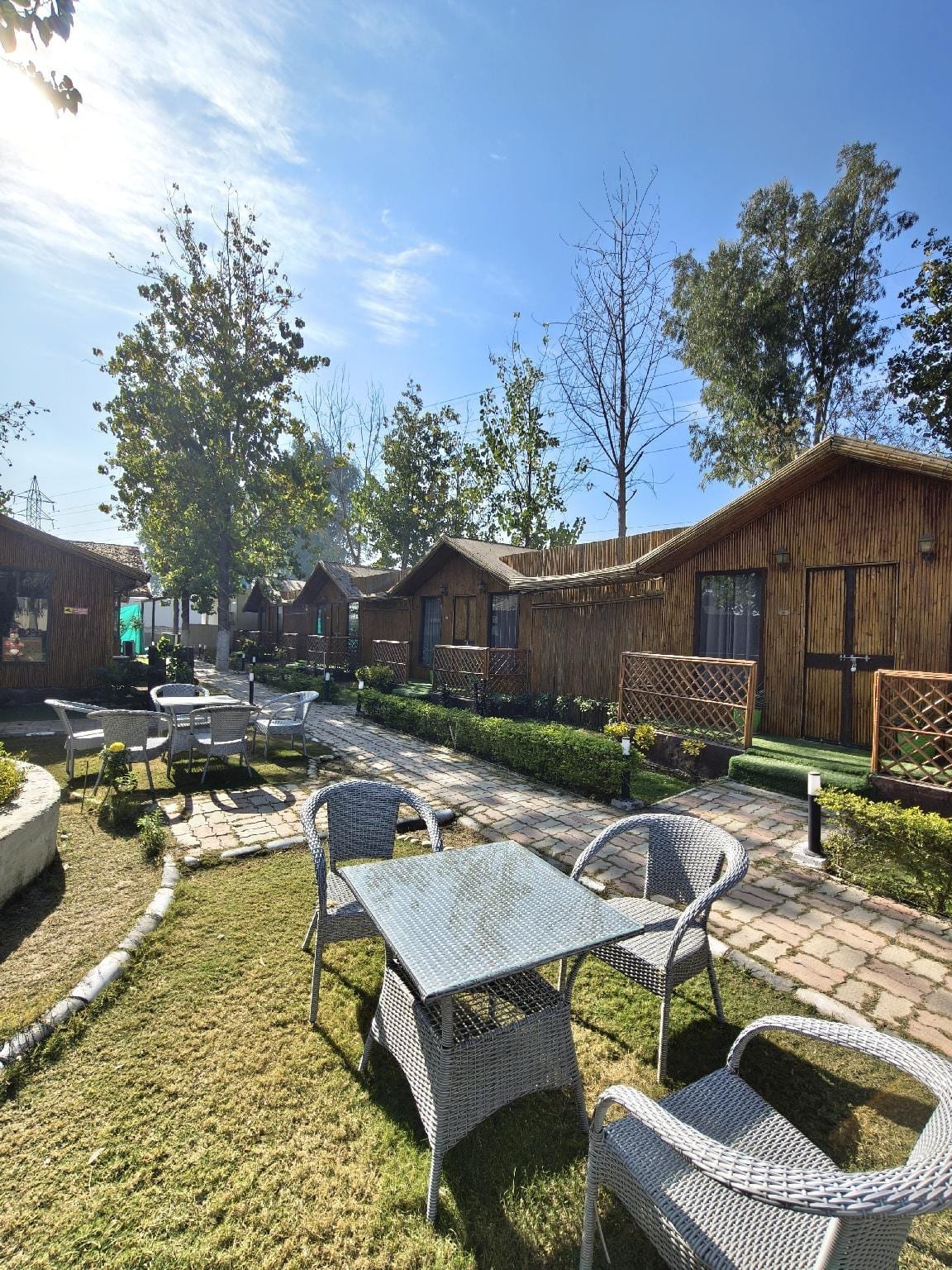 Lawn and garden seating in front of the huts