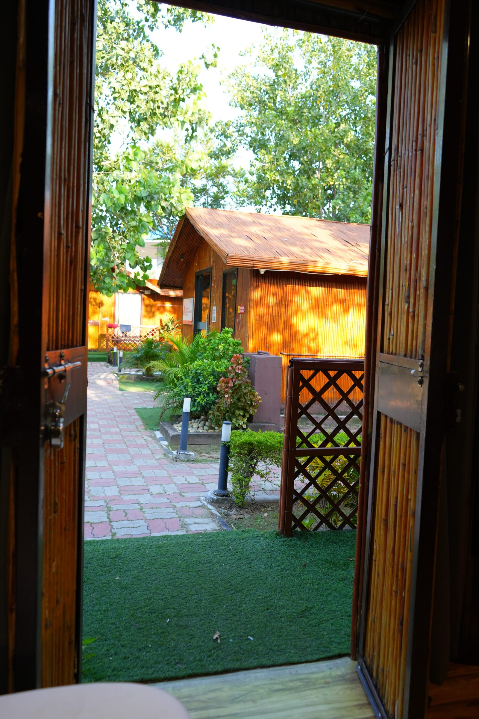 The garden seen from a hut doorway