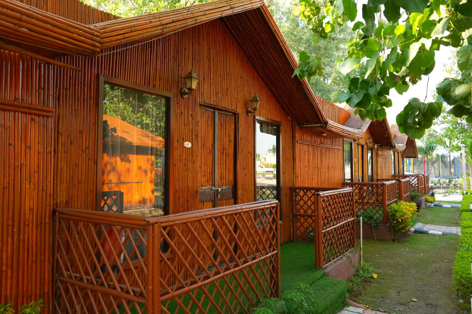 A hut verandah with its windows and lattice rail