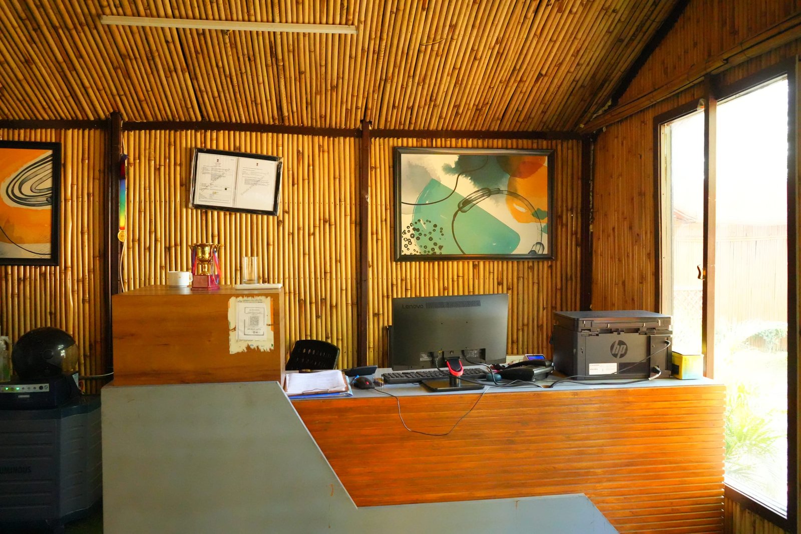 The reception desk under a bamboo ceiling