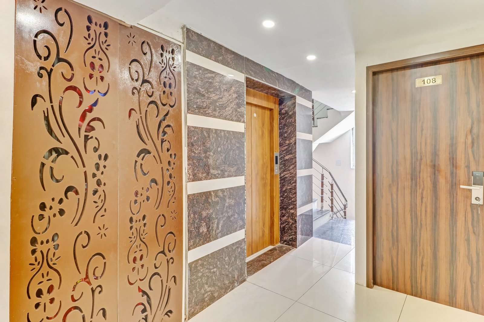 Carved screens and marble along the landing