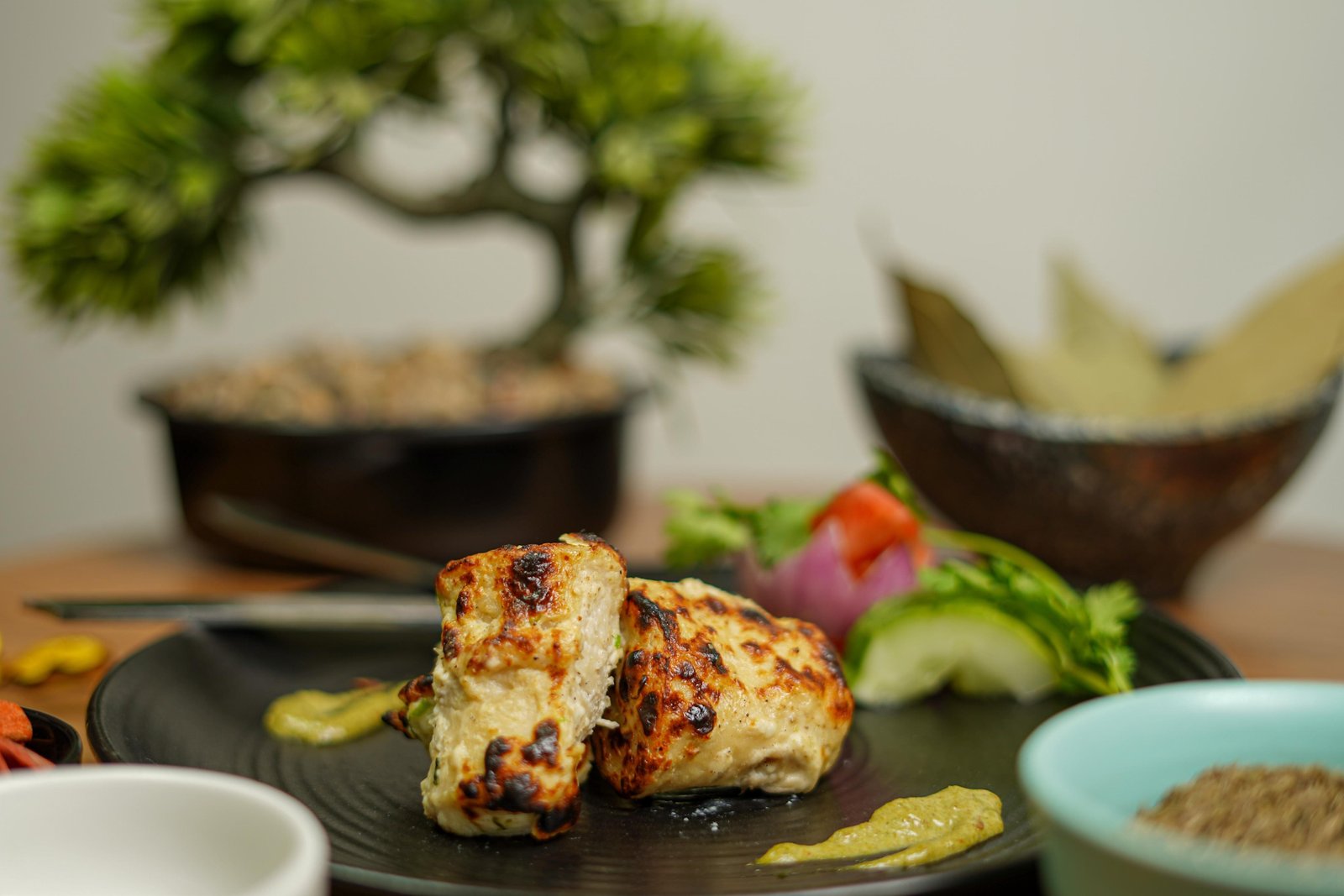 Grilled kebabs on a dark plate