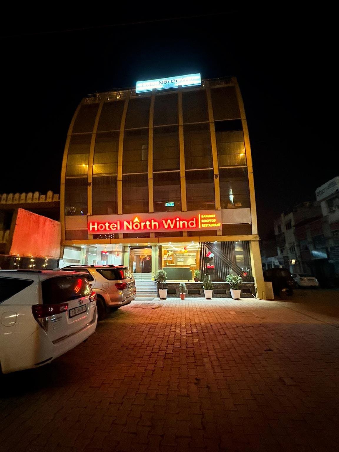 The hotel seen from the road after dark