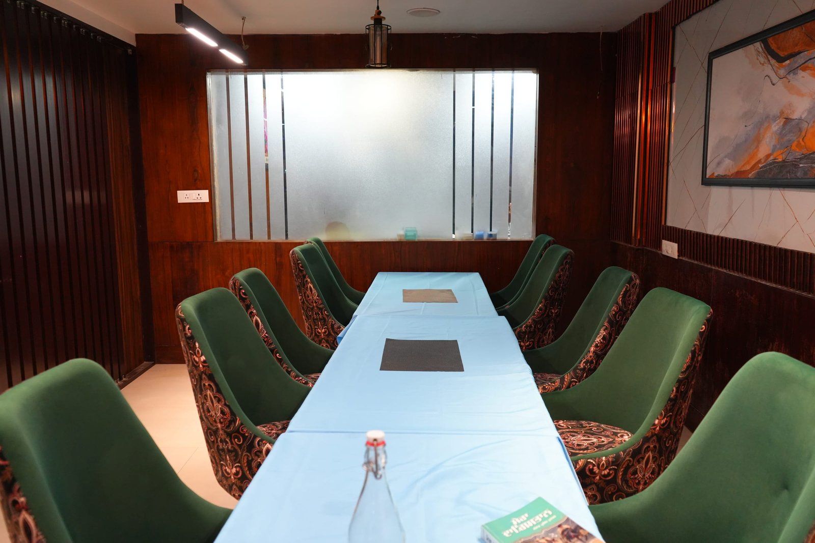The hall seen down its length, panelled walls either side