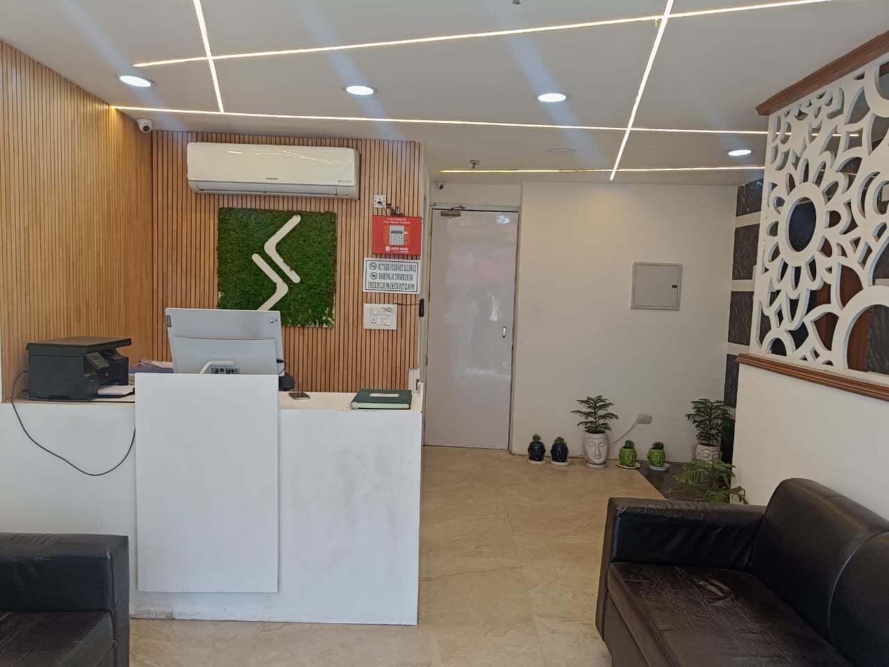 The front desk beside its fretwork screen